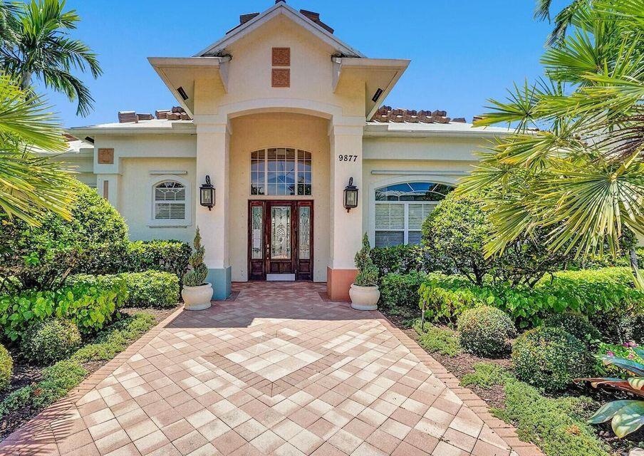 9857 Baywinds Boulevard, Unit 9302 West Palm Beach, FL 33411 - Photo 33 of 45 a front view of a house with a yard