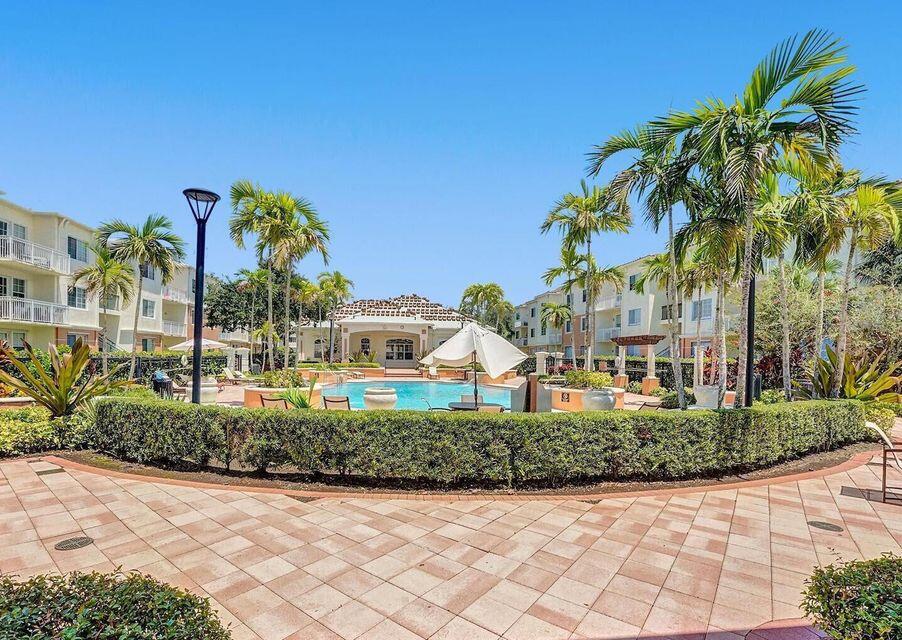 9857 Baywinds Boulevard, Unit 9302 West Palm Beach, FL 33411 - Photo 38 of 45 a front view of multi story residential apartment building