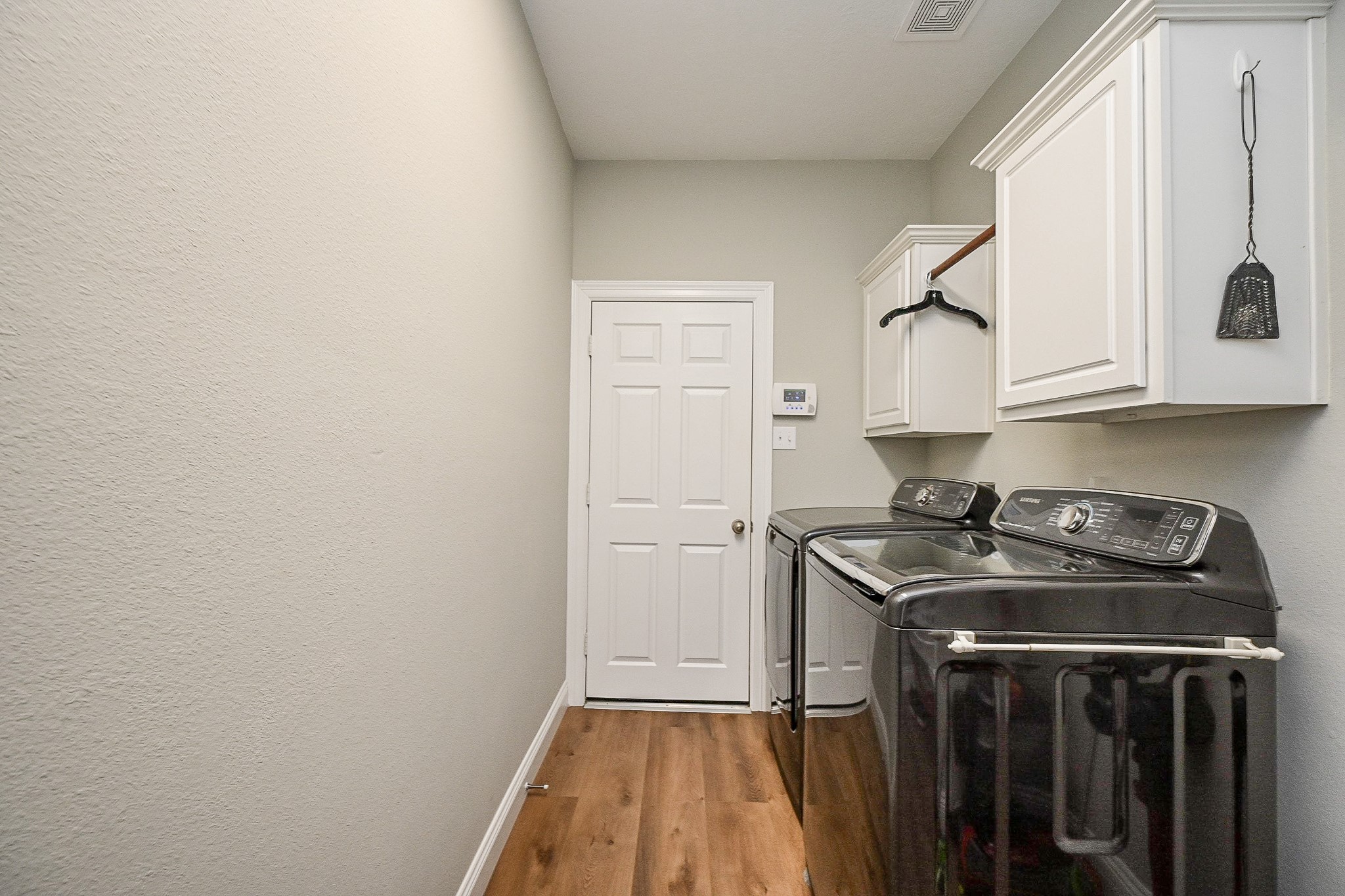 25608 Kransburg Ridge Court Porter, TX 77365 - Photo 24 of 30 Large sized laundry room leading to the three car tandem garage.