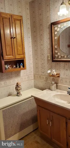 a bathroom with a sink double vanity and a mirror