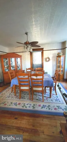 a stove top oven sitting inside of a kitchen
