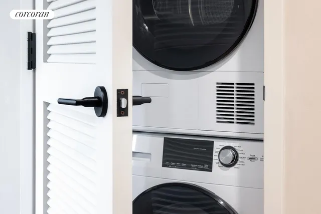 a close view of a utility room with dryer and washer