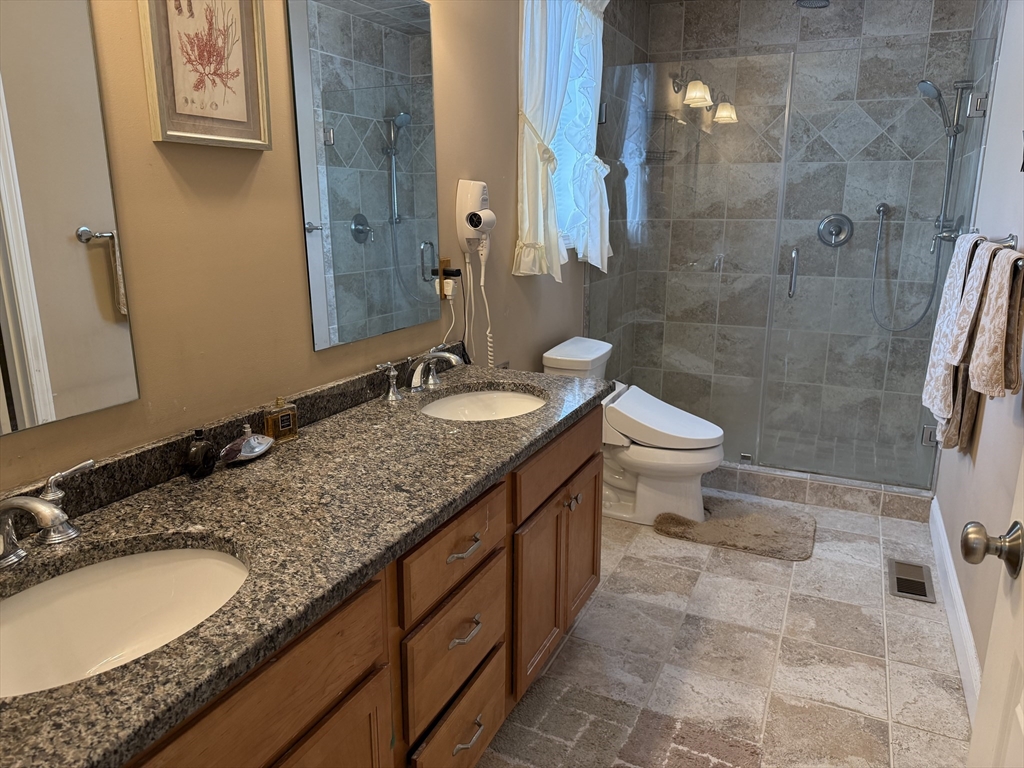 17 Lynwood Street Fall River, MA 02721 - Photo 11 of 28 a bathroom with a granite countertop sink toilet and shower
