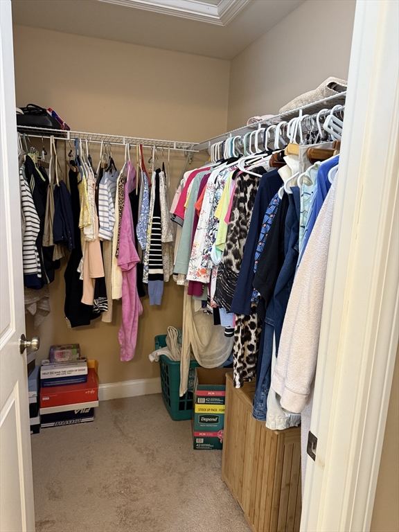 17 Lynwood Street Fall River, MA 02721 - Photo 12 of 28 a view of walk in closet with clothes and shoes