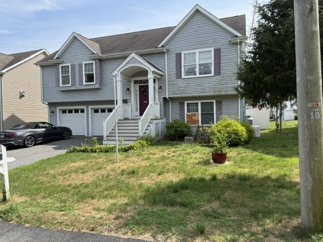 17 Lynwood Street Fall River, MA 02721 - Photo 2 of 28 a front view of a house with a yard