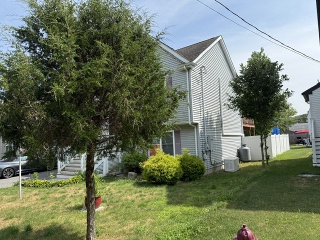 17 Lynwood Street Fall River, MA 02721 - Photo 28 of 28 a view of a house with a backyard and a tree