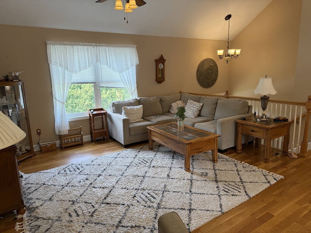 17 Lynwood Street Fall River, MA 02721 - Photo 3 of 28 a living room with furniture a window and a table