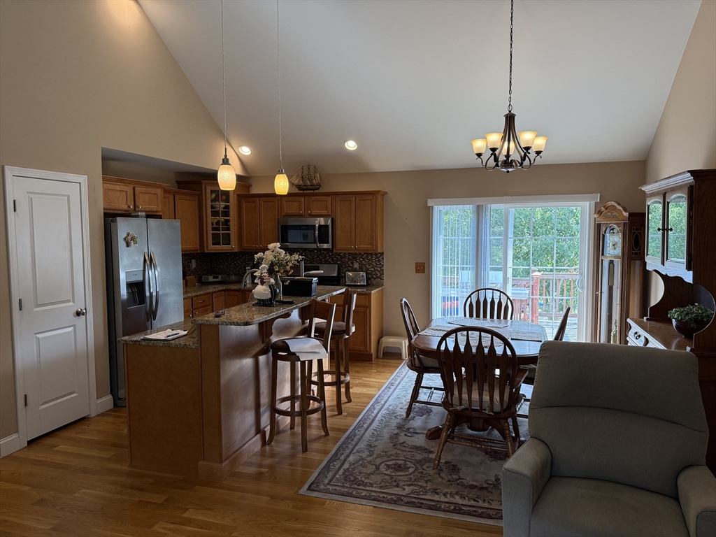 17 Lynwood Street Fall River, MA 02721 - Photo 5 of 28 a view of a dining room with furniture a chandelier and wooden floor