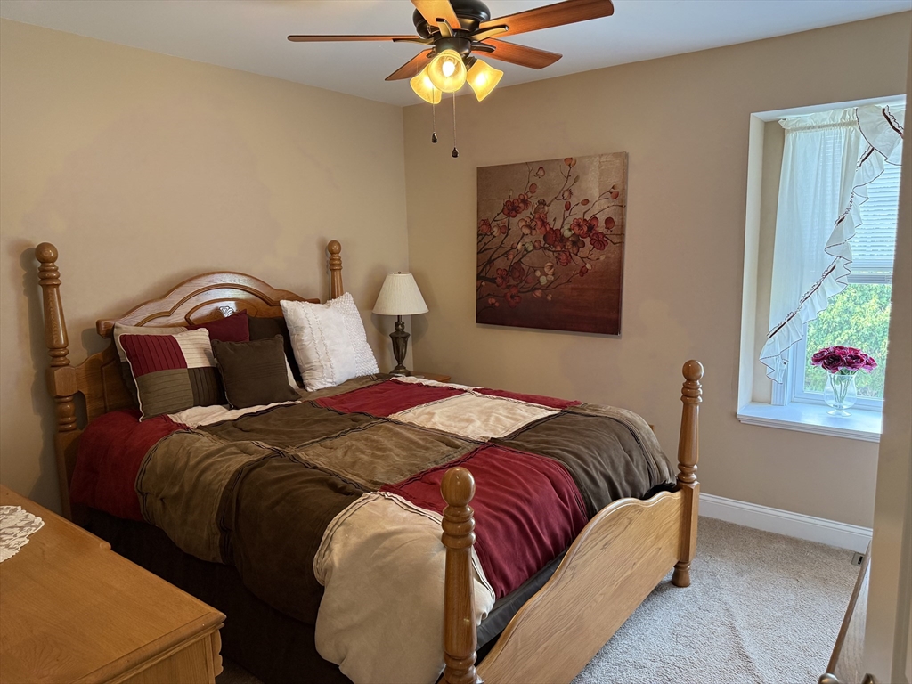 17 Lynwood Street Fall River, MA 02721 - Photo 8 of 28 a bedroom with a bed and a window