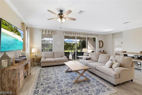 a living room with a large window and a table