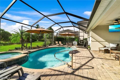a view of swimming pool with a patio
