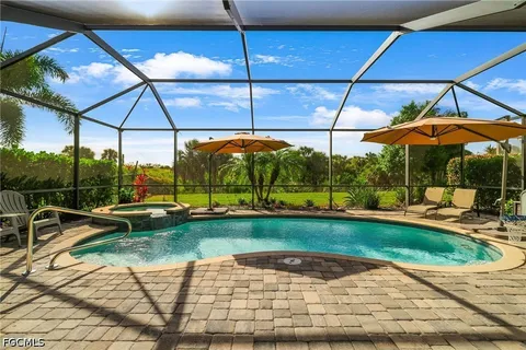 a swimming pool with an outdoor seating