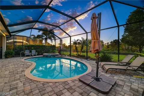 a view of a swimming pool with a patio