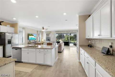 a kitchen with sink cabinets and window