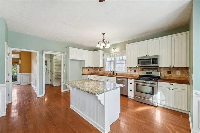 a view of an entryway with wooden floor