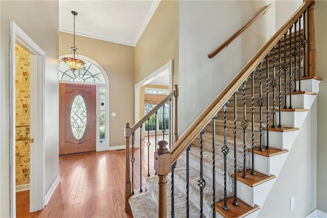 a view of an entryway with wooden floor