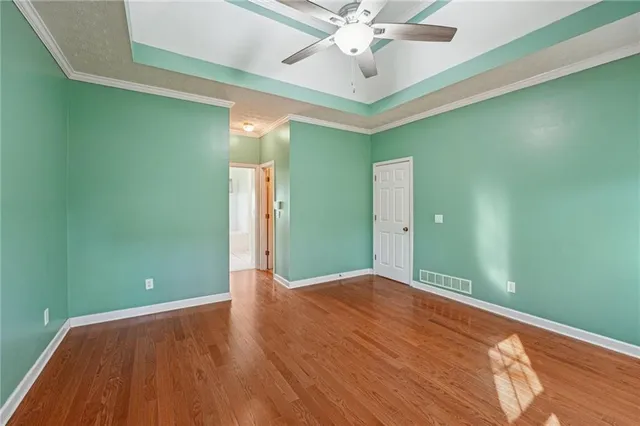 an empty room with windows and door