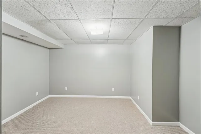 a bathroom with a shower and a sink