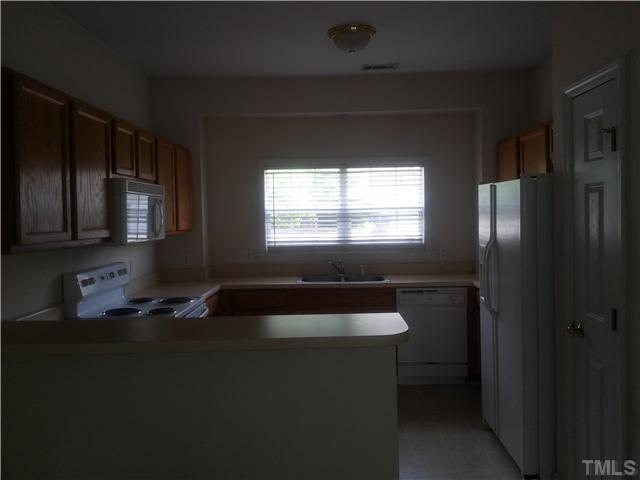 4606 Centrebrook Circle Raleigh, NC 27616 - Photo 2 of 6 a bathroom with a sink a toilet a window and bathtub