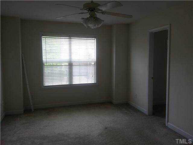 4606 Centrebrook Circle Raleigh, NC 27616 - Photo 4 of 6 an empty room with a window