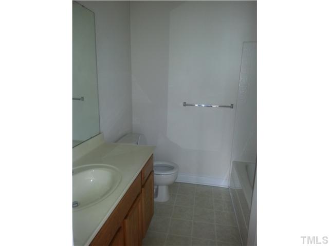 4606 Centrebrook Circle Raleigh, NC 27616 - Photo 6 of 6 a bathroom with a granite countertop sink and toilet