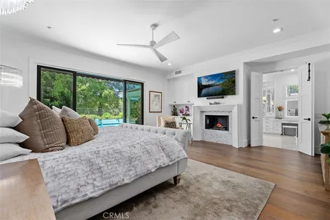 a living room with furniture fireplace and flat screen tv