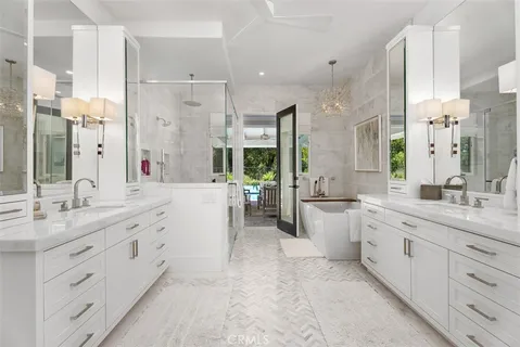 a large bathroom with a granite countertop sink mirror and a