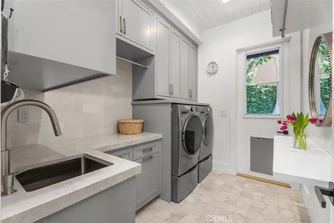 a kitchen with a refrigerator and sink