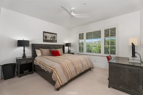 a bedroom with a bed and a desk