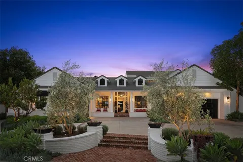 a front view of a house with sitting space and garden
