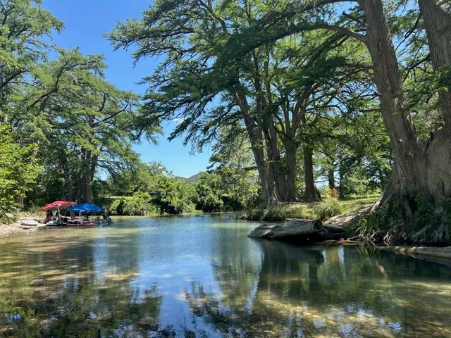 a view of a lake with a yard