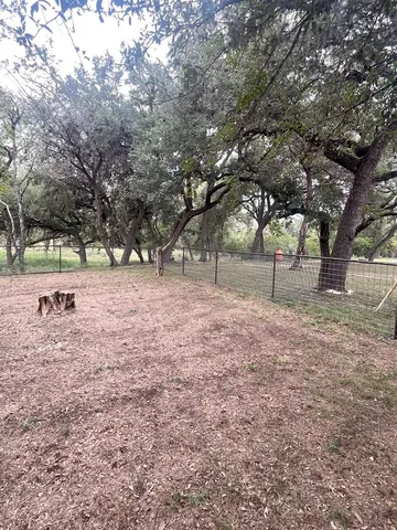a backyard of a house with lots of green space