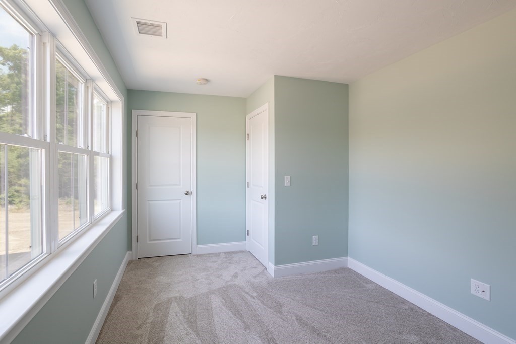 6 Katlyn Circle Rochester, MA 02770 - Photo 20 of 37 a view of an empty room with a window
