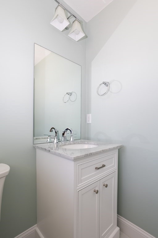 6 Katlyn Circle Rochester, MA 02770 - Photo 23 of 37 a bathroom with a granite countertop sink a toilet and mirror
