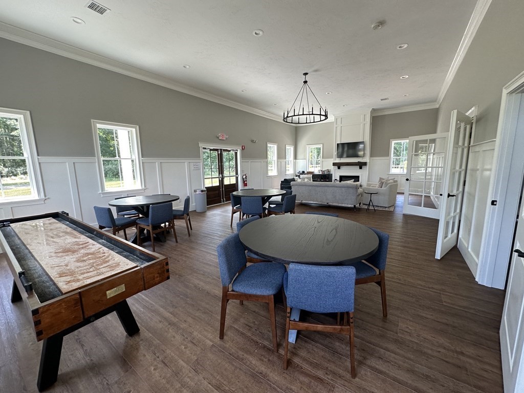6 Katlyn Circle Rochester, MA 02770 - Photo 27 of 37 a view of a a dining room with furniture window and wooden floor