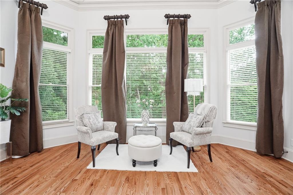 8340 Colonial Place Duluth, GA 30097 - Photo 23 of 74 a living room with furniture and a window