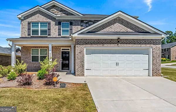 front view of a house with a small yard