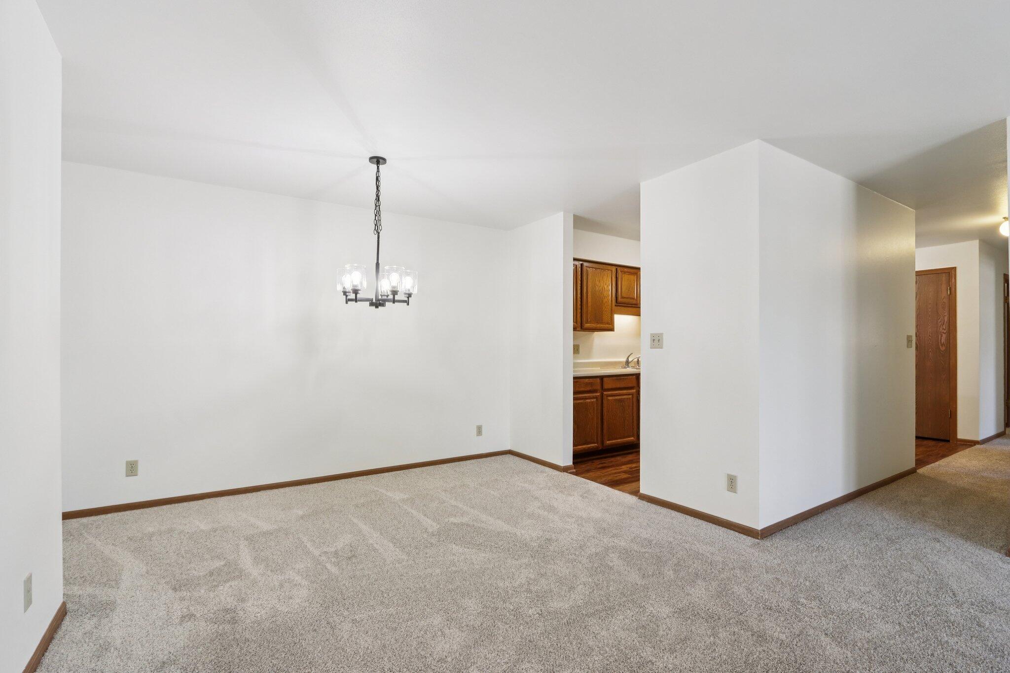 4417 South Green Ridge Circle, Unit G Greenfield, WI 53220 - Photo 8 of 34 Dining to Kitchen and Hall