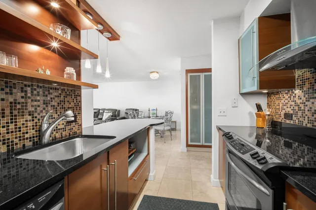 a kitchen with a stove and a microwave