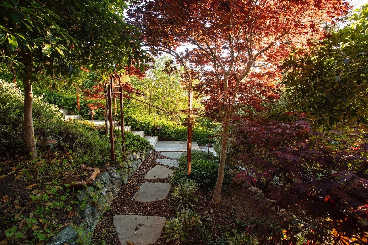47701 Coast Ridge Road Big Sur, CA 93920 - Photo 12 of 25 a backyard of a house with lots of green space