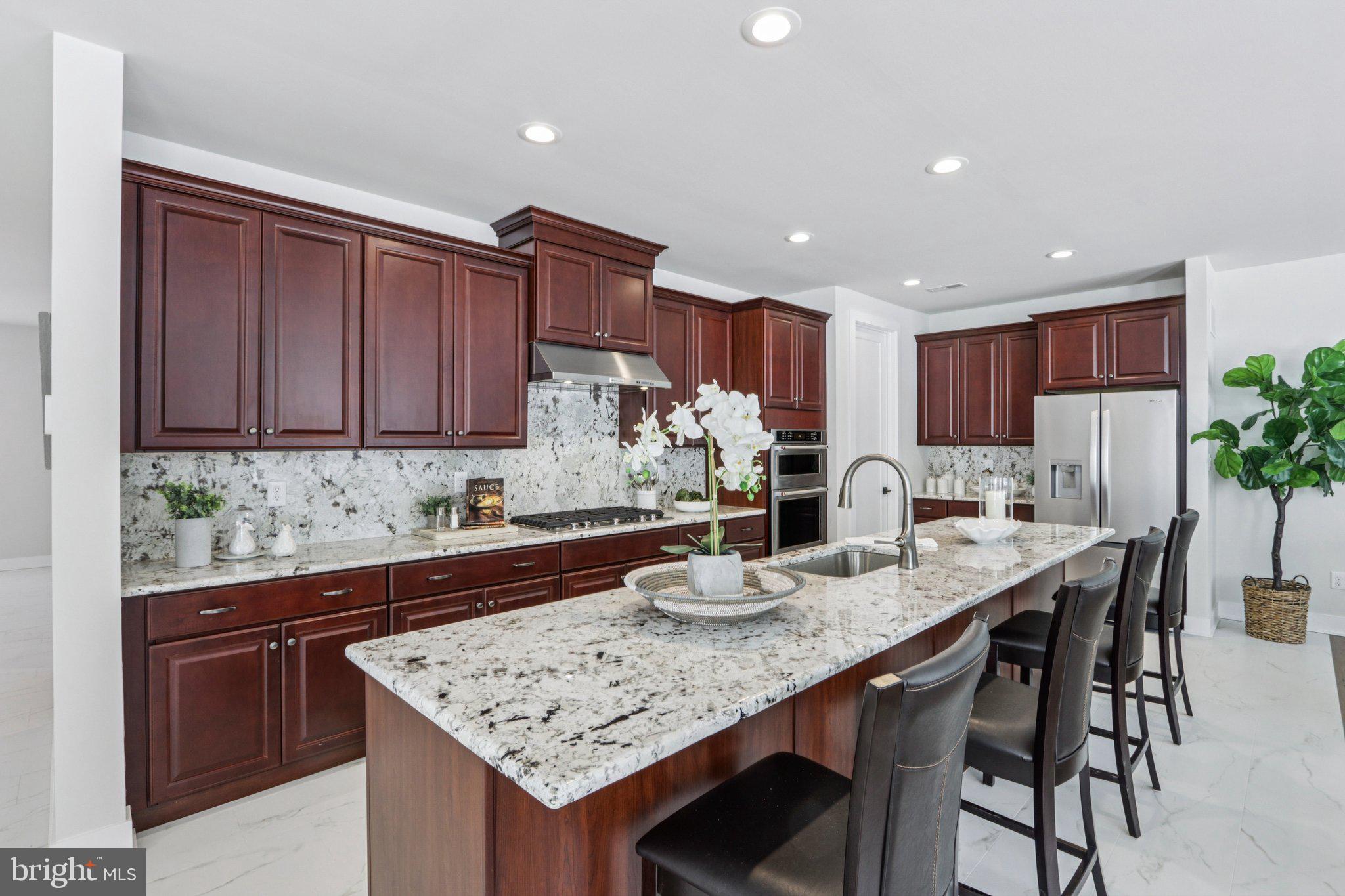 127 Alroy Road Malvern, PA 19355 - Photo 53 of 53 a kitchen with granite countertop kitchen island stainless steel appliances a sink and cabinets