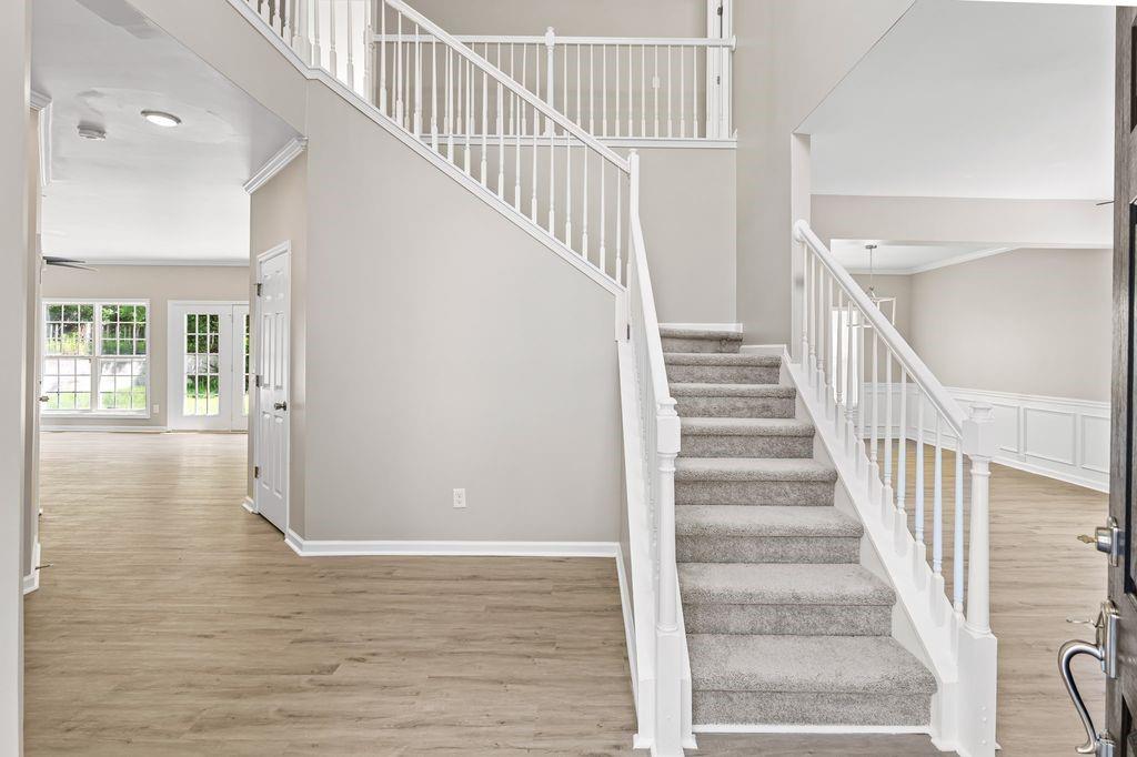 473 Greyhawk Way Fairburn, GA 30213 - Photo 2 of 34 a view of staircase with white walls and white walls