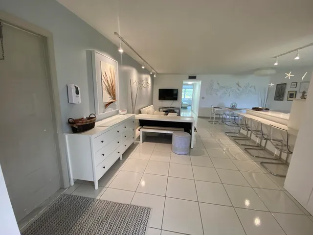 a kitchen with stainless steel appliances a sink a stove a microwave and cabinets