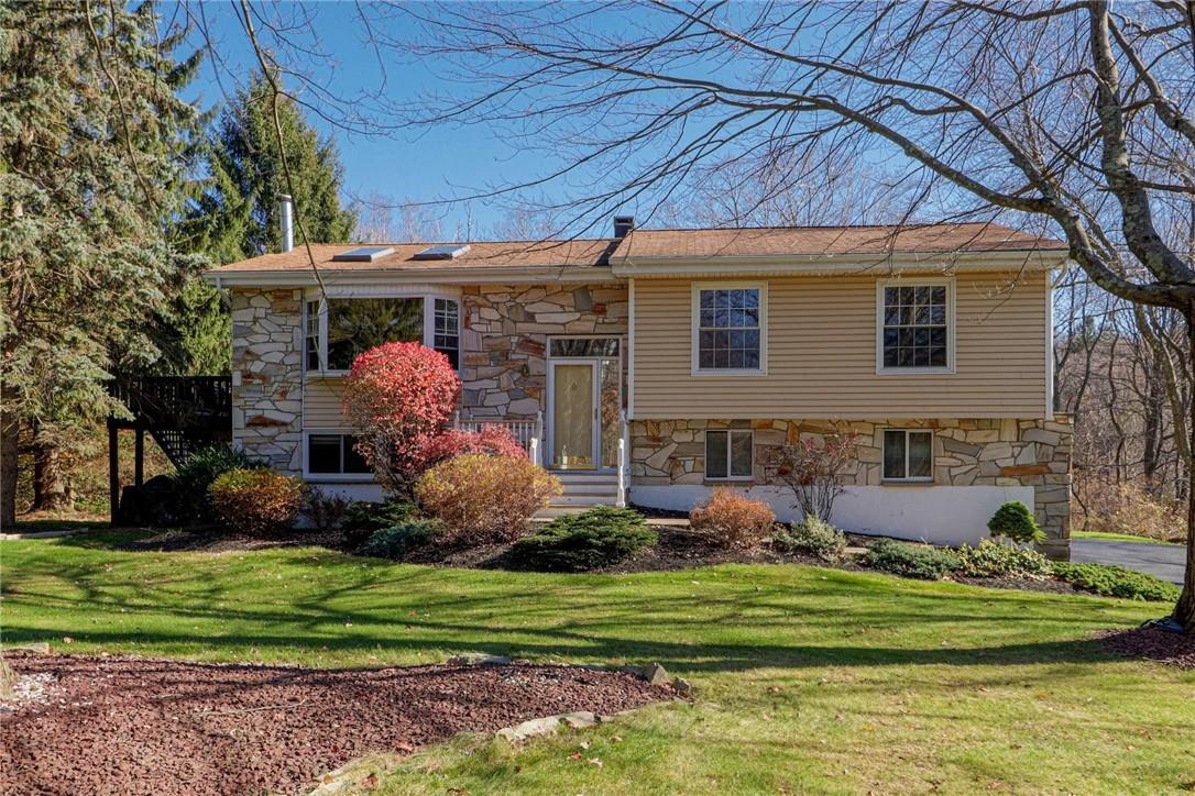 159 Overhill Road Stormville, NY 12582 - Photo 1 of 1 a front view of a house with a yard and outdoor seating