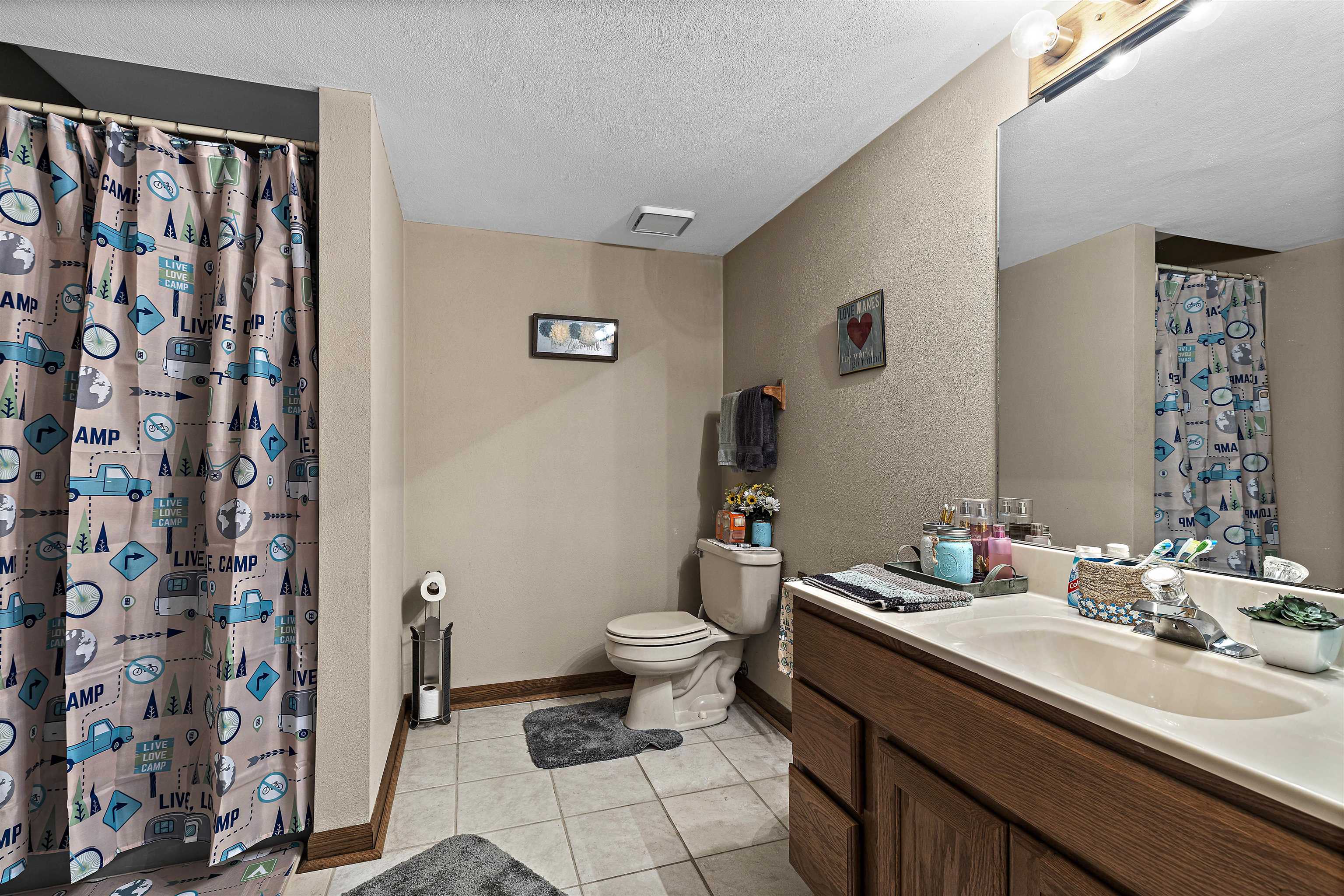 5611 Gray Eagle Road Roscoe, IL 61073 - Photo 33 of 43 a bathroom with a sink toilet and shower