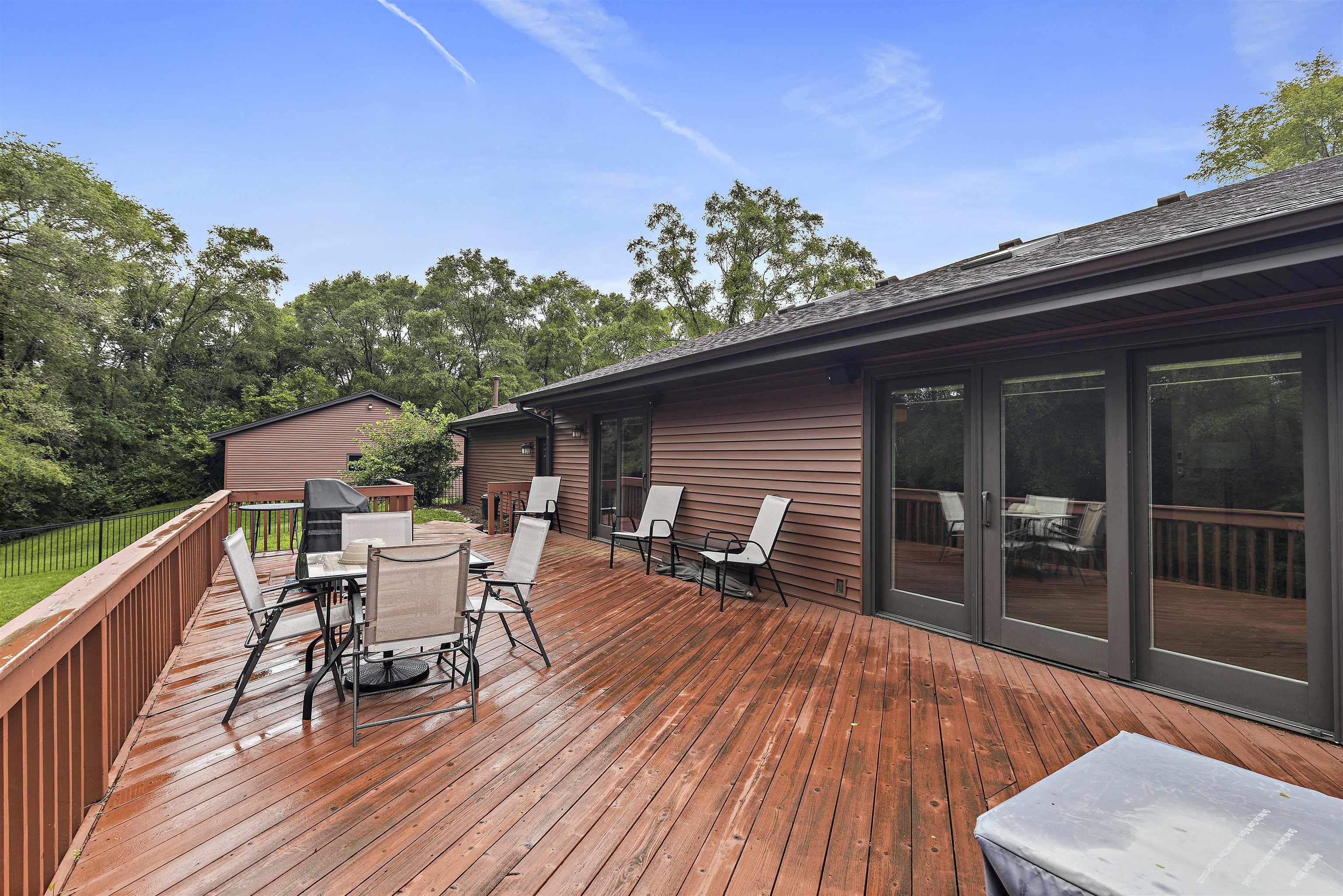 5611 Gray Eagle Road Roscoe, IL 61073 - Photo 40 of 43 a roof deck with table and chairs and wooden floor