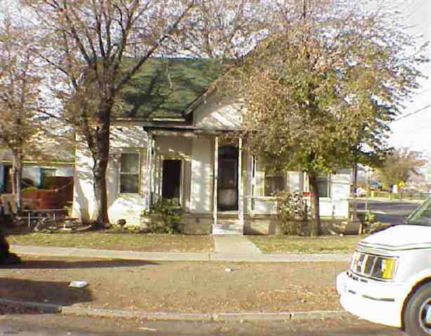 a view of a building with a yard