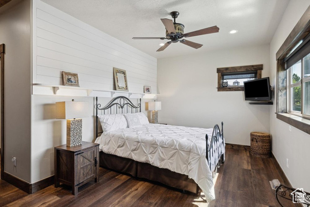 6117 North Rocky Ridge Road Peoa, UT 84061 - Photo 45 of 83 Bedroom with dark hardwood / wood-style flooring and ceiling fan