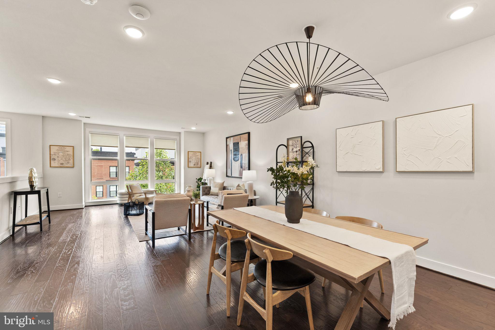 1867 Michael Faraday Drive, Unit 4 Reston, VA 20190 - Photo 11 of 53 a view of a dining room with furniture window and wooden floor