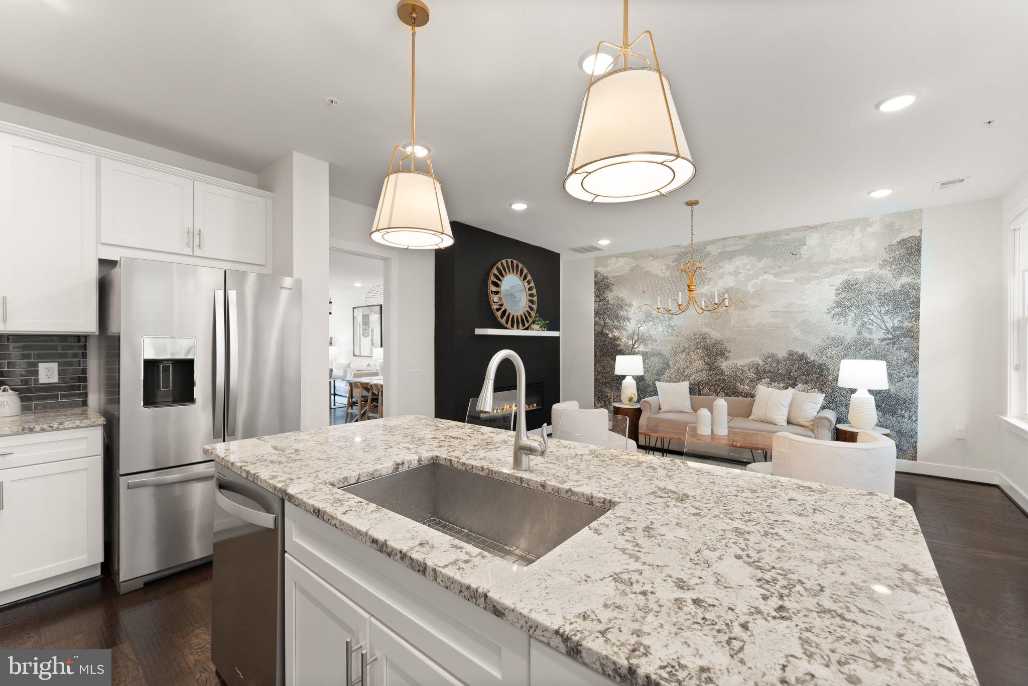 1867 Michael Faraday Drive, Unit 4 Reston, VA 20190 - Photo 16 of 53 a kitchen with a refrigerator a sink and a stove